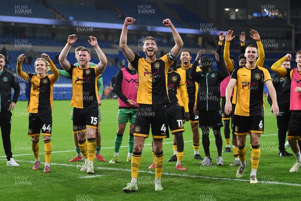 071025 - Cardiff City v Newport County - Vertu Trophy Group Stage - Newport players celebrate with their fans at full time
