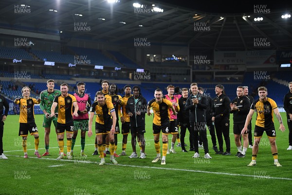 071025 - Cardiff City v Newport County - Vertu Trophy Group Stage - Newport players celebrate with their fans at full time
