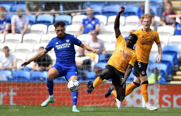 310721 - Cardiff City v Newport County - Preseason Friendly - Mark Harris of Cardiff City is tackled by Christoper Missilou of Newport County