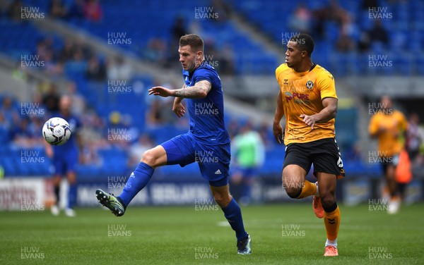 310721 - Cardiff City v Newport County - Preseason Friendly - James Collins of Cardiff City is challenged by Priestley Farquharson of Newport County
