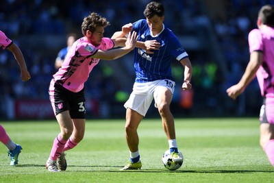 250426 - Cardiff City v Northampton Town - Sky Bet League 1 - Rubin Colwill of Cardiff City is challenged by Max Dyche of Northampton 