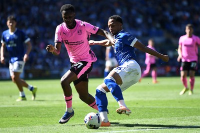 250426 - Cardiff City v Northampton Town - Sky Bet League 1 - Chris Willock of Cardiff City is challenged by Kamarai Simon-Swyer of Northampton 