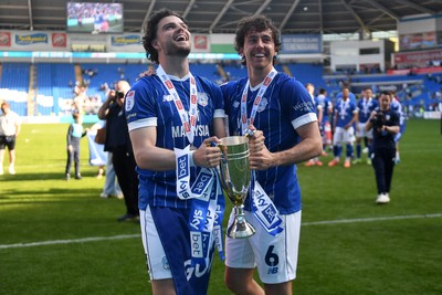 250426 - Cardiff City v Northampton Town - Sky Bet League 1 - Ollie Tanner of Cardiff City and Ryan Wintle of Cardiff City celebrate promotion at full time