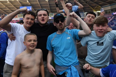 250426 - Cardiff City v Northampton Town - Sky Bet League 1 - Fans run onto the pitch at full time in celebration 