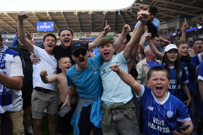 250426 - Cardiff City v Northampton Town - Sky Bet League 1 - Fans run onto the pitch at full time in celebration 