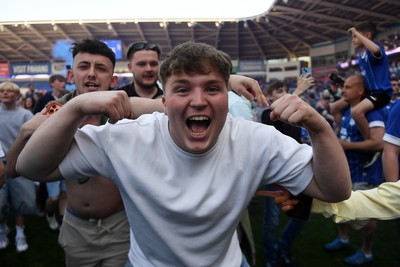 250426 - Cardiff City v Northampton Town - Sky Bet League 1 - Fans run onto the pitch at full time in celebration 