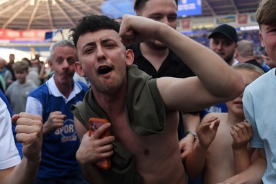 250426 - Cardiff City v Northampton Town - Sky Bet League 1 - Fans run onto the pitch at full time in celebration 