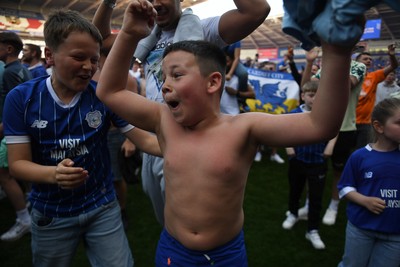 250426 - Cardiff City v Northampton Town - Sky Bet League 1 - Fans run onto the pitch at full time in celebration 