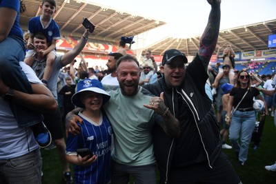 250426 - Cardiff City v Northampton Town - Sky Bet League 1 - Fans run onto the pitch at full time in celebration 