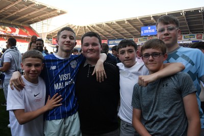 250426 - Cardiff City v Northampton Town - Sky Bet League 1 - Fans run onto the pitch at full time in celebration 