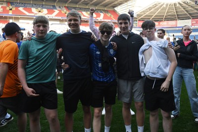 250426 - Cardiff City v Northampton Town - Sky Bet League 1 - Fans run onto the pitch at full time in celebration 