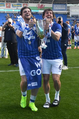 250426 - Cardiff City v Northampton Town - Sky Bet League 1 - Ollie Tanner of Cardiff City and Ryan Wintle of Cardiff City celebrate promotion at full time