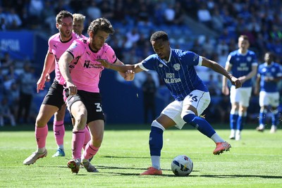 250426 - Cardiff City v Northampton Town - Sky Bet League 1 - Chris Willock of Cardiff City is challenged by Max Dyche of Northampton 