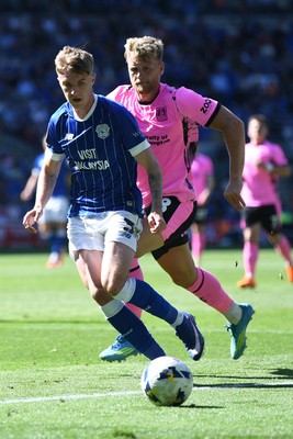 250426 - Cardiff City v Northampton Town - Sky Bet League 1 - Joel Bagan of Cardiff City is challenged by Cameron McGeehan of Northampton 