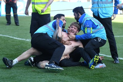 250426 - Cardiff City v Northampton Town - Sky Bet League 1 - pitch invader at full time