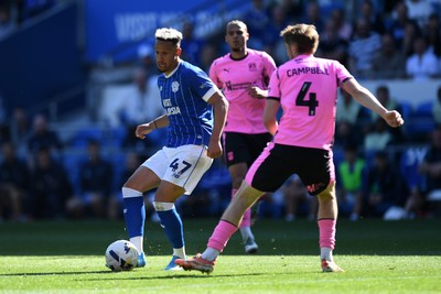 250426 - Cardiff City v Northampton Town - Sky Bet League 1 - Callum Robinson of Cardiff City is challenged by Dean Campbell of Northampton 