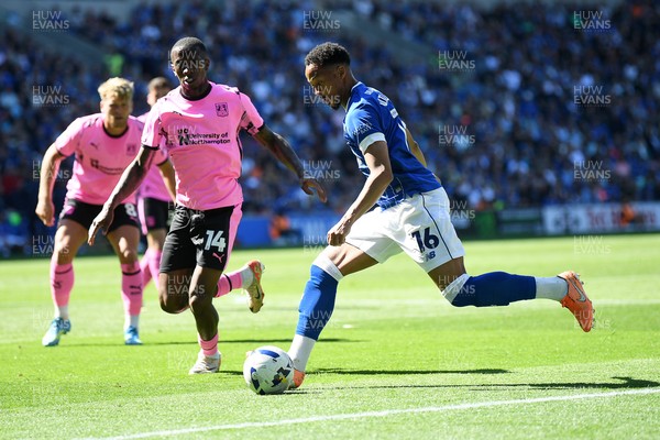 250426 - Cardiff City v Northampton Town - Sky Bet League 1 - Chris Willock of Cardiff City is challenged by Tyrese Fornah of Northampton 