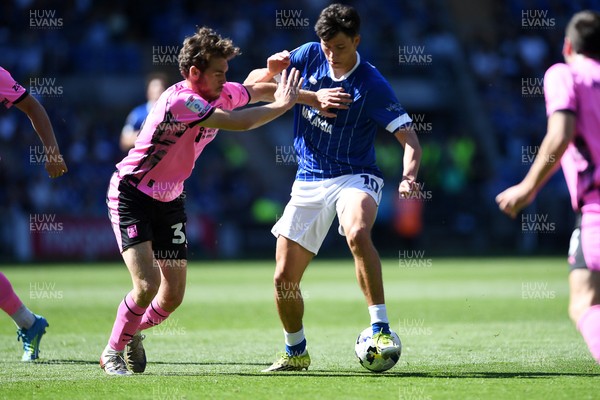 250426 - Cardiff City v Northampton Town - Sky Bet League 1 - Rubin Colwill of Cardiff City is challenged by Max Dyche of Northampton 