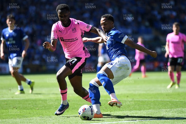 250426 - Cardiff City v Northampton Town - Sky Bet League 1 - Chris Willock of Cardiff City is challenged by Kamarai Simon-Swyer of Northampton 