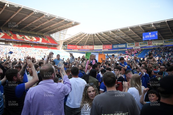250426 - Cardiff City v Northampton Town - Sky Bet League 1 - Fans run onto the pitch at full time in celebration 