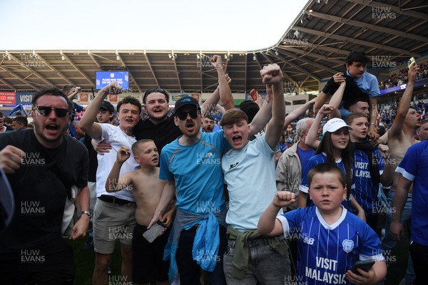 250426 - Cardiff City v Northampton Town - Sky Bet League 1 - Fans run onto the pitch at full time in celebration 