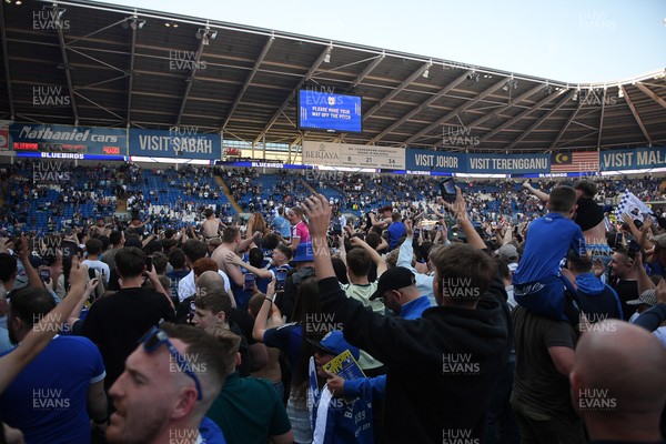 250426 - Cardiff City v Northampton Town - Sky Bet League 1 - Fans run onto the pitch at full time in celebration 