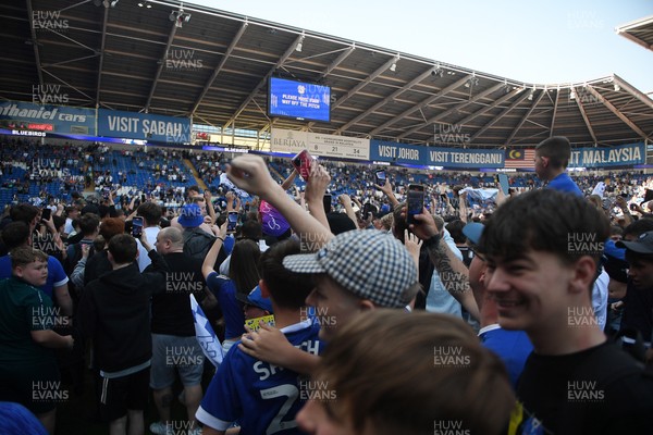 250426 - Cardiff City v Northampton Town - Sky Bet League 1 - Fans run onto the pitch at full time in celebration 