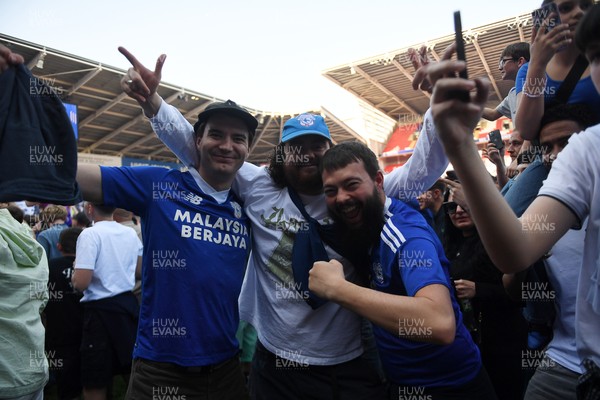 250426 - Cardiff City v Northampton Town - Sky Bet League 1 - Fans run onto the pitch at full time in celebration 