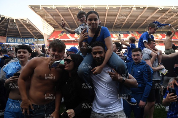 250426 - Cardiff City v Northampton Town - Sky Bet League 1 - Fans run onto the pitch at full time in celebration 