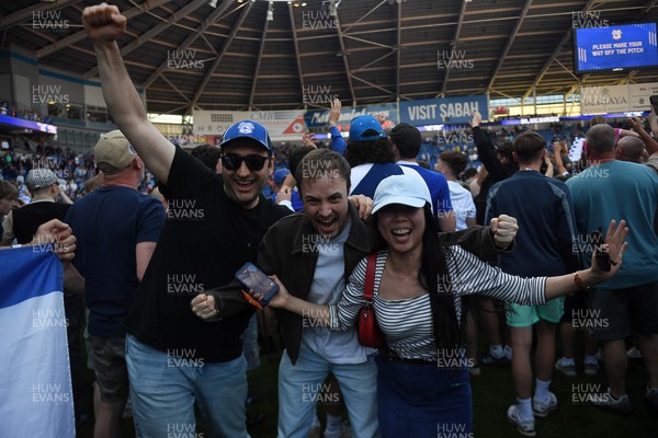 250426 - Cardiff City v Northampton Town - Sky Bet League 1 - Fans run onto the pitch at full time in celebration 