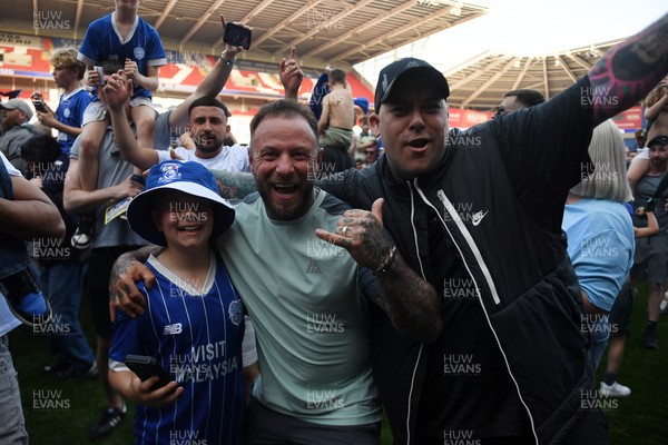 250426 - Cardiff City v Northampton Town - Sky Bet League 1 - Fans run onto the pitch at full time in celebration 