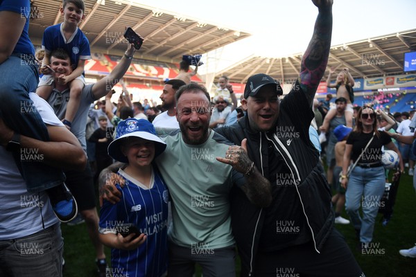 250426 - Cardiff City v Northampton Town - Sky Bet League 1 - Fans run onto the pitch at full time in celebration 