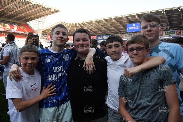 250426 - Cardiff City v Northampton Town - Sky Bet League 1 - Fans run onto the pitch at full time in celebration 