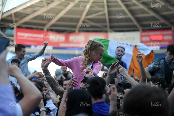 250426 - Cardiff City v Northampton Town - Sky Bet League 1 - Fans run onto the pitch at full time in celebration 