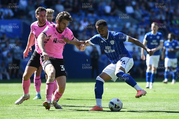 250426 - Cardiff City v Northampton Town - Sky Bet League 1 - Chris Willock of Cardiff City is challenged by Max Dyche of Northampton 