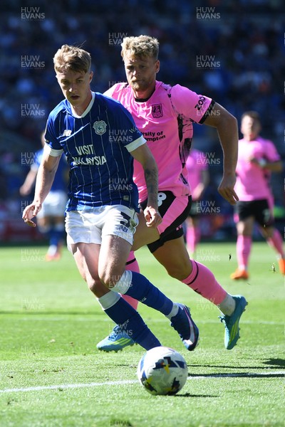 250426 - Cardiff City v Northampton Town - Sky Bet League 1 - Joel Bagan of Cardiff City is challenged by Cameron McGeehan of Northampton 