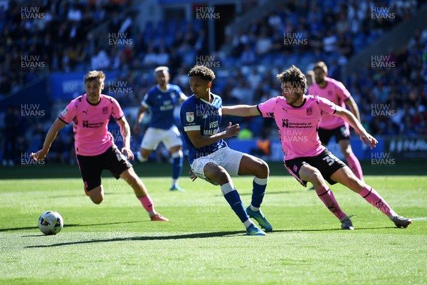 250426 - Cardiff City v Northampton Town - Sky Bet League 1 - Omari Kellyman of Cardiff City is challenged by Max Dyche of Northampton 