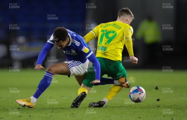160121 - Cardiff City v Norwich City, Sky Bet Championship - Josh Murphy of Cardiff City and Jacob Lungi Sorensen of Norwich City compete for the ball