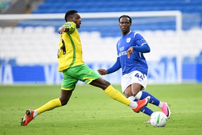 250826 - Cardiff City v Norwich City - Carabao Cup Second Round - Ronan Kpakio of Cardiff City is challenged by Anthony Musaba of Norwich