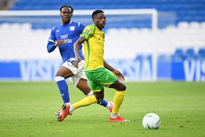250826 - Cardiff City v Norwich City - Carabao Cup Second Round - Ronan Kpakio of Cardiff City is challenged by Anthony Musaba of Norwich