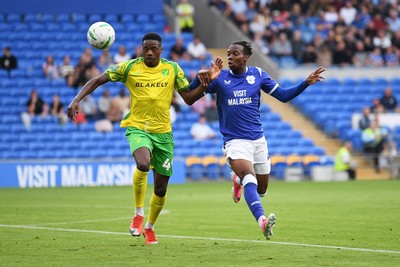 250826 - Cardiff City v Norwich City - Carabao Cup Second Round - Ronan Kpakio of Cardiff City is challenged by Anthony Musaba of Norwich