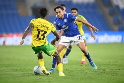 250826 - Cardiff City v Norwich City - Carabao Cup Second Round - Joel Colwill of Cardiff City is challenged by Darlin Yongwa of Norwich