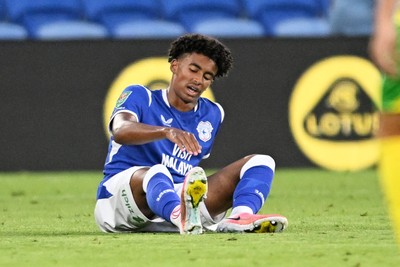 250826 - Cardiff City v Norwich City - Carabao Cup Second Round - Noah Anyadike of Cardiff City goes off the field injured