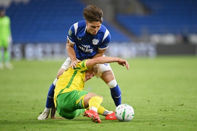 250826 - Cardiff City v Norwich City - Carabao Cup Second Round - Cian Ashford of Cardiff City is challenged by Pelle Mattsson of Norwich