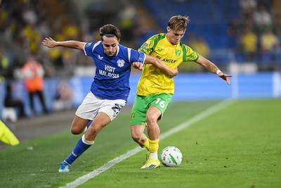250826 - Cardiff City v Norwich City - Carabao Cup Second Round - Joel Colwill of Cardiff City is challenged by Jacob Wright of Norwich