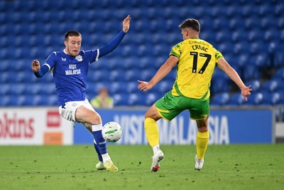 250826 - Cardiff City v Norwich City - Carabao Cup Second Round - Jack Moylan of Cardiff City is challenged by Ante Crnac of Norwich