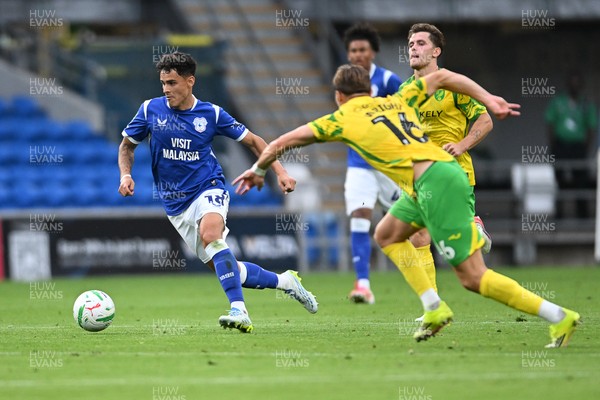 250826 - Cardiff City v Norwich City - Carabao Cup Second Round - Alex Robertson of Cardiff City is challenged by Jacob Wright of Norwich