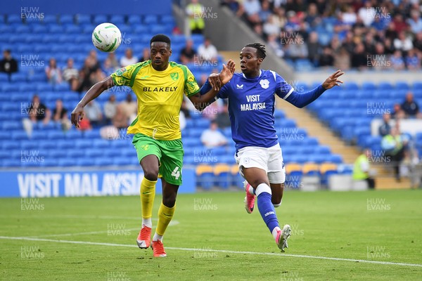 250826 - Cardiff City v Norwich City - Carabao Cup Second Round - Ronan Kpakio of Cardiff City is challenged by Anthony Musaba of Norwich