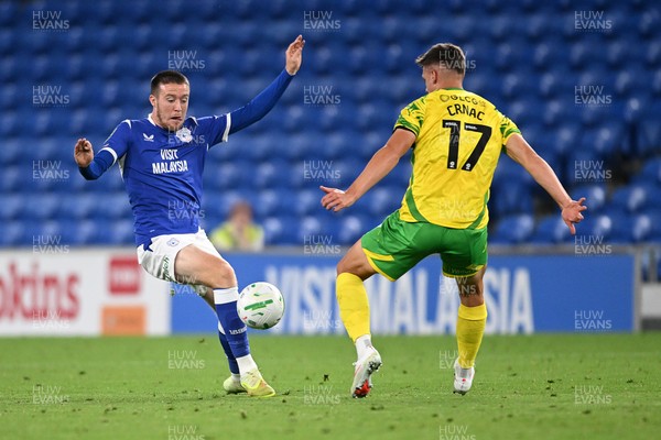 250826 - Cardiff City v Norwich City - Carabao Cup Second Round - Jack Moylan of Cardiff City is challenged by Ante Crnac of Norwich