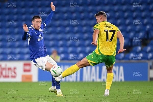 250826 - Cardiff City v Norwich City - Carabao Cup Second Round - Jack Moylan of Cardiff City is challenged by Ante Crnac of Norwich